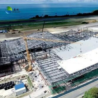 ガラス繊維強化プラスチック製スカイライトと耐震7〜9級を備えた鉄骨構造倉庫、頑丈なH型鋼ビームを採用